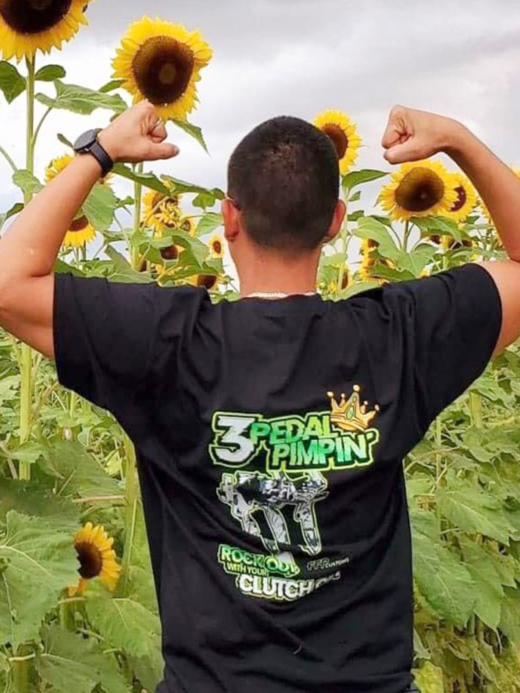 man posing with 3 pedal pimpin shirt on